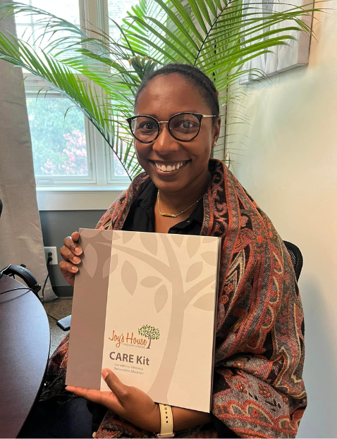 Woman holding Joys House Care Kit