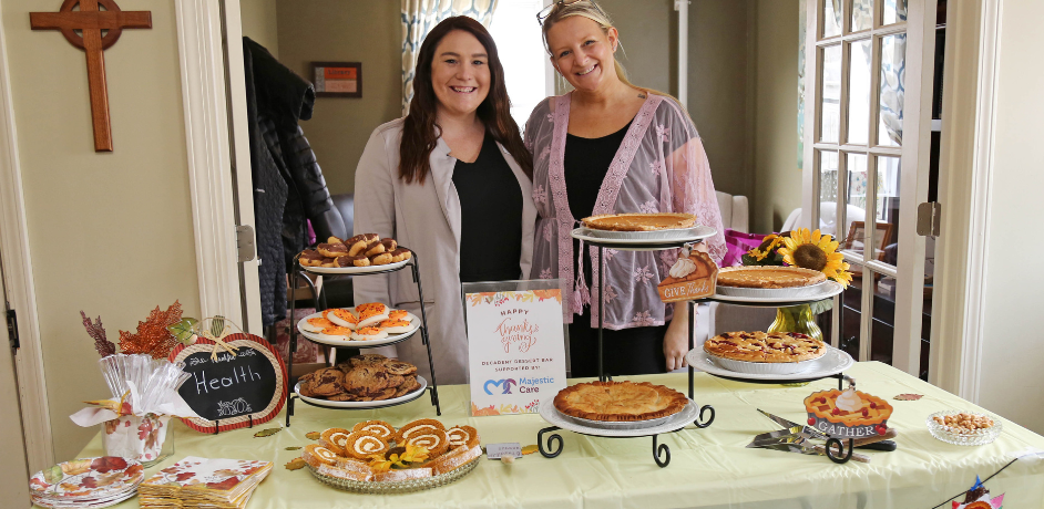 Volunteers serving desserts at Joy's House