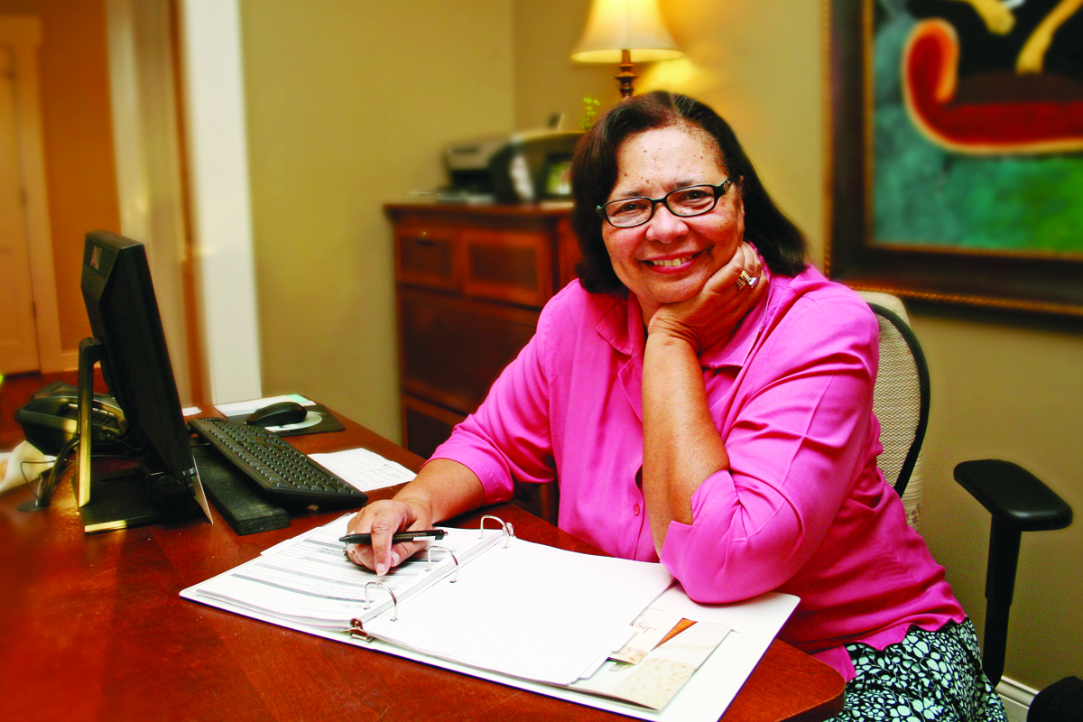 Woman reading Joy's House CARE Kits