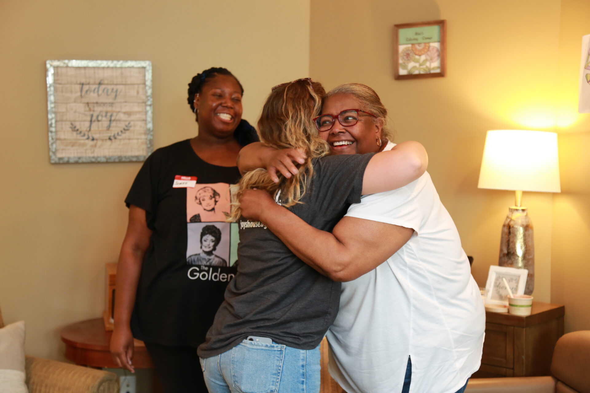 caregiver hug at Joy's House Adult Daycare